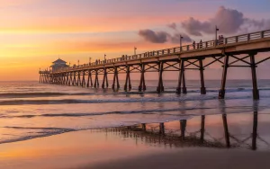A beautiful sunrise view of the iconic Flagler Beach fishing pier in Florida, representing the coastal community where GRIT Roofing provides expert local roofing services.